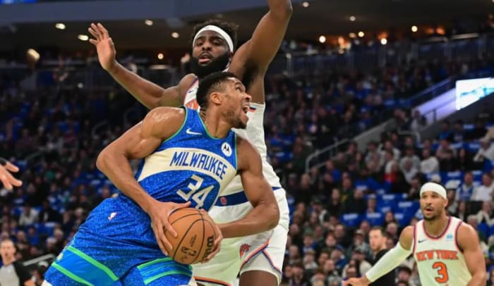 Mitchell Robinson guards Giannis Antetokounmpo during last week's quarterfinal